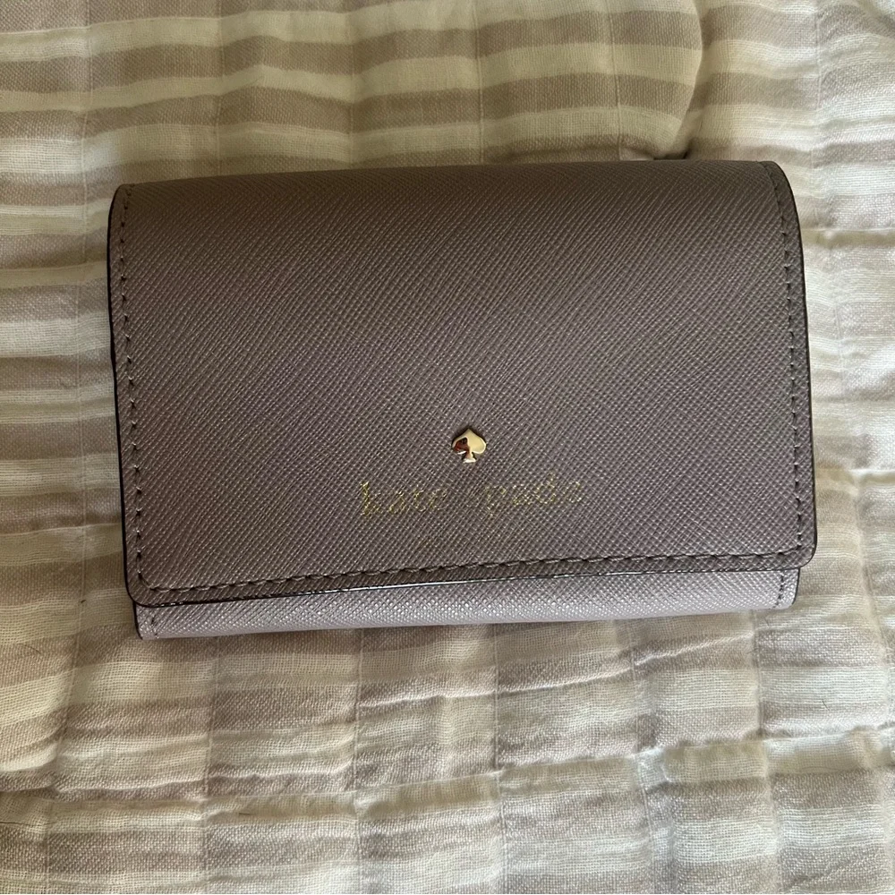 kate spade taupe leather compact wallet with gold logo